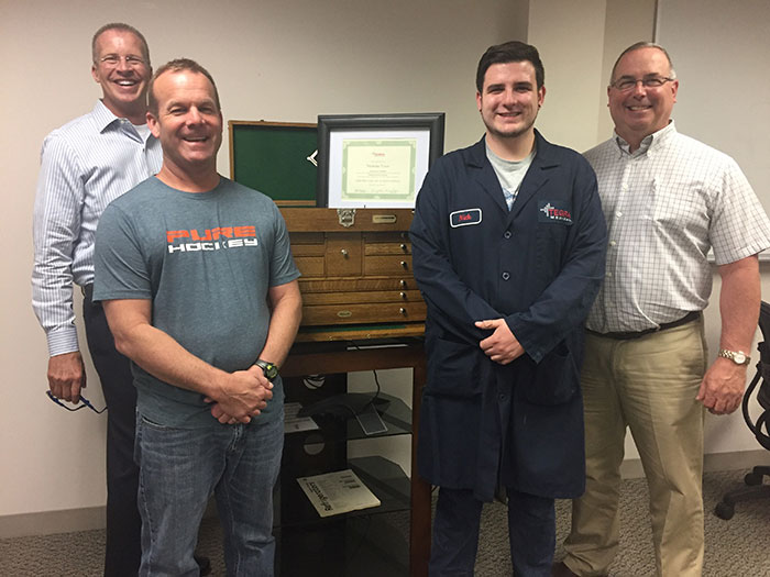 Nick Voyer’s graduation ceremony where he was presented with a Gerstner tool chest. From left to right: J. Mark King, CEO/President, Kenneth Nadeau, GENESIS Tech Center Operations Supervisor, Nick Voyer, and Brian Rua, Director of Manufacturing.