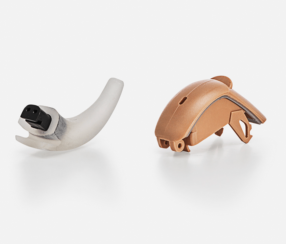 examples of two-shot technology - ear hook and battery door for hearing aid